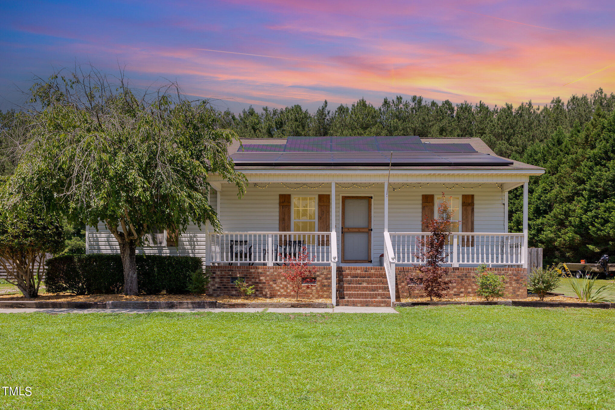 112 Forest Ridge Drive Willow Spring, NC 27592 - Photo 1 of 21 a front view of a house with a garden