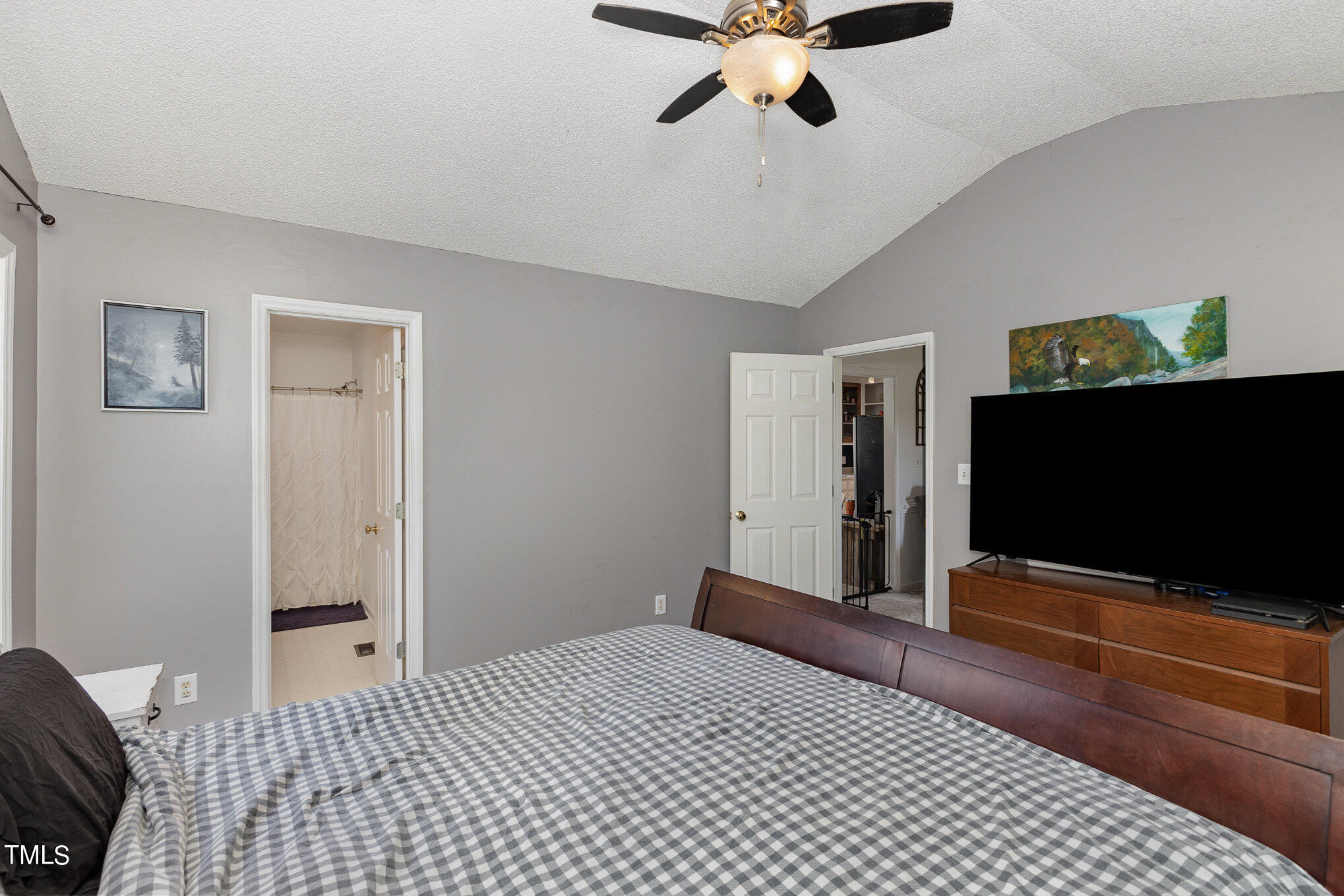112 Forest Ridge Drive Willow Spring, NC 27592 - Photo 12 of 21 a bedroom with a bed and a flat screen tv