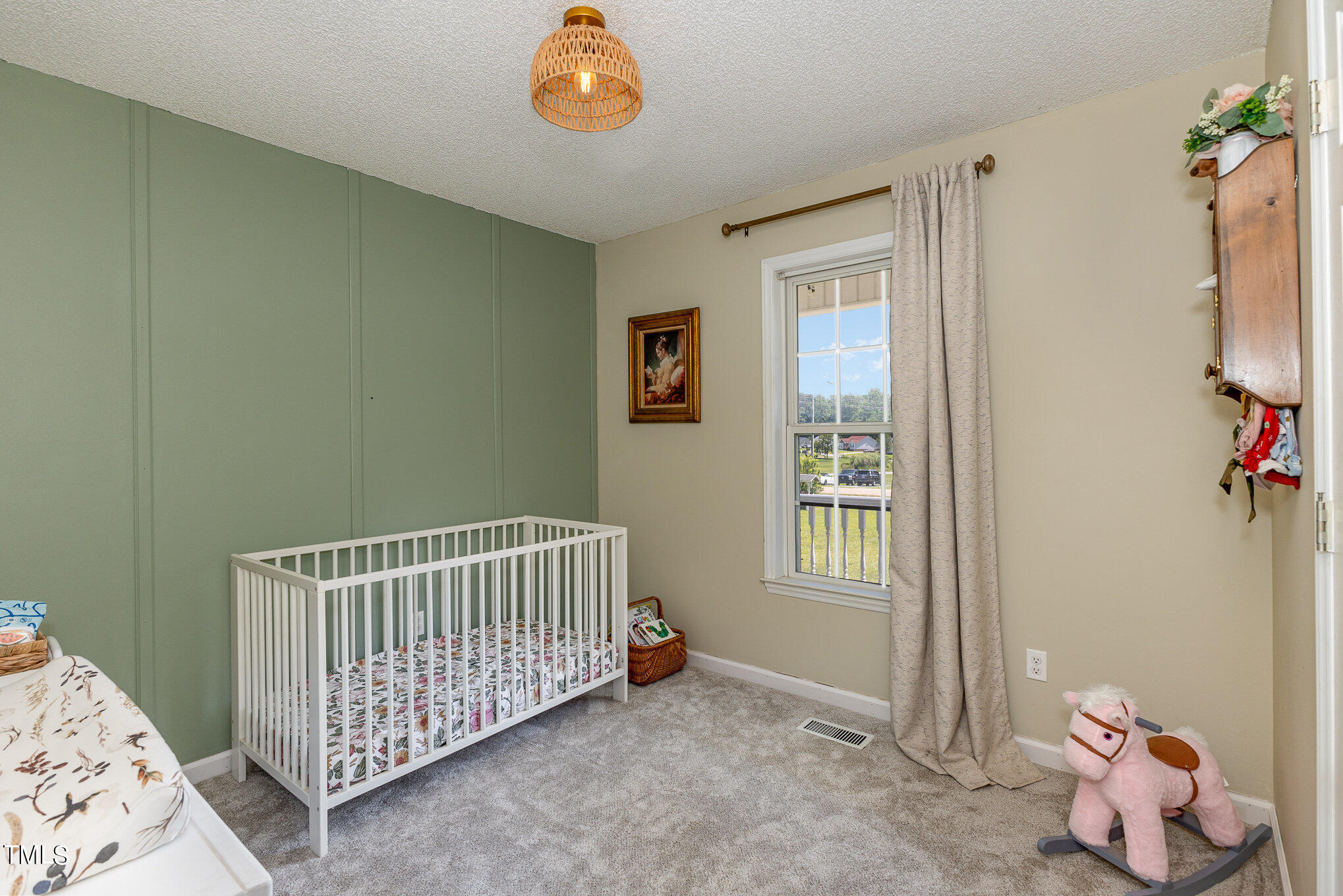 112 Forest Ridge Drive Willow Spring, NC 27592 - Photo 14 of 21 a bedroom with a bed and wooden floor