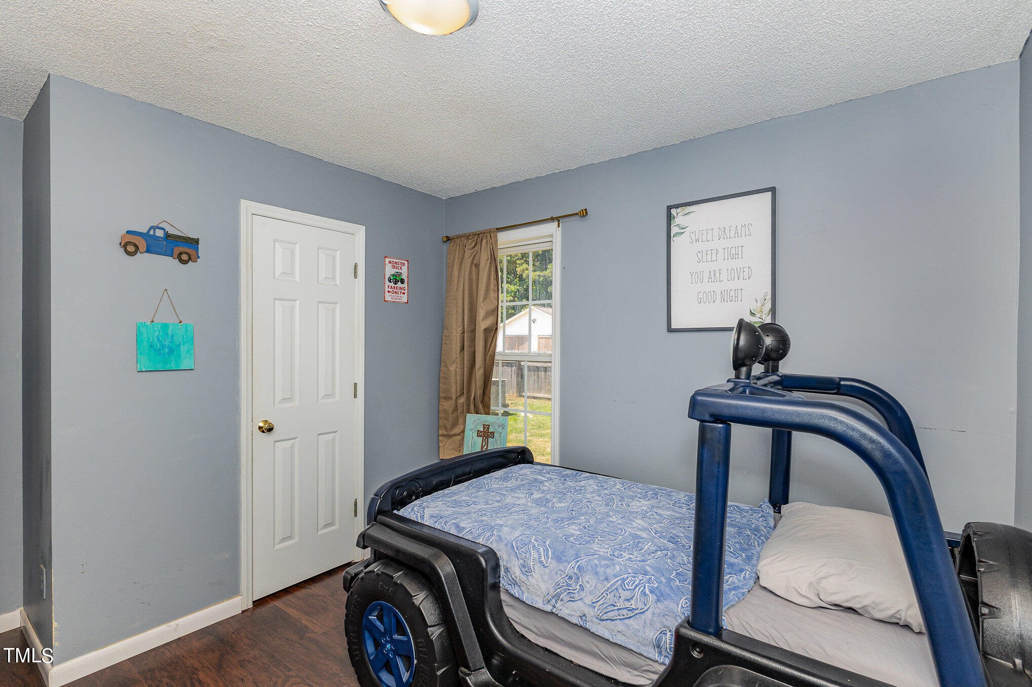 112 Forest Ridge Drive Willow Spring, NC 27592 - Photo 15 of 21 a bedroom with a bed and a window