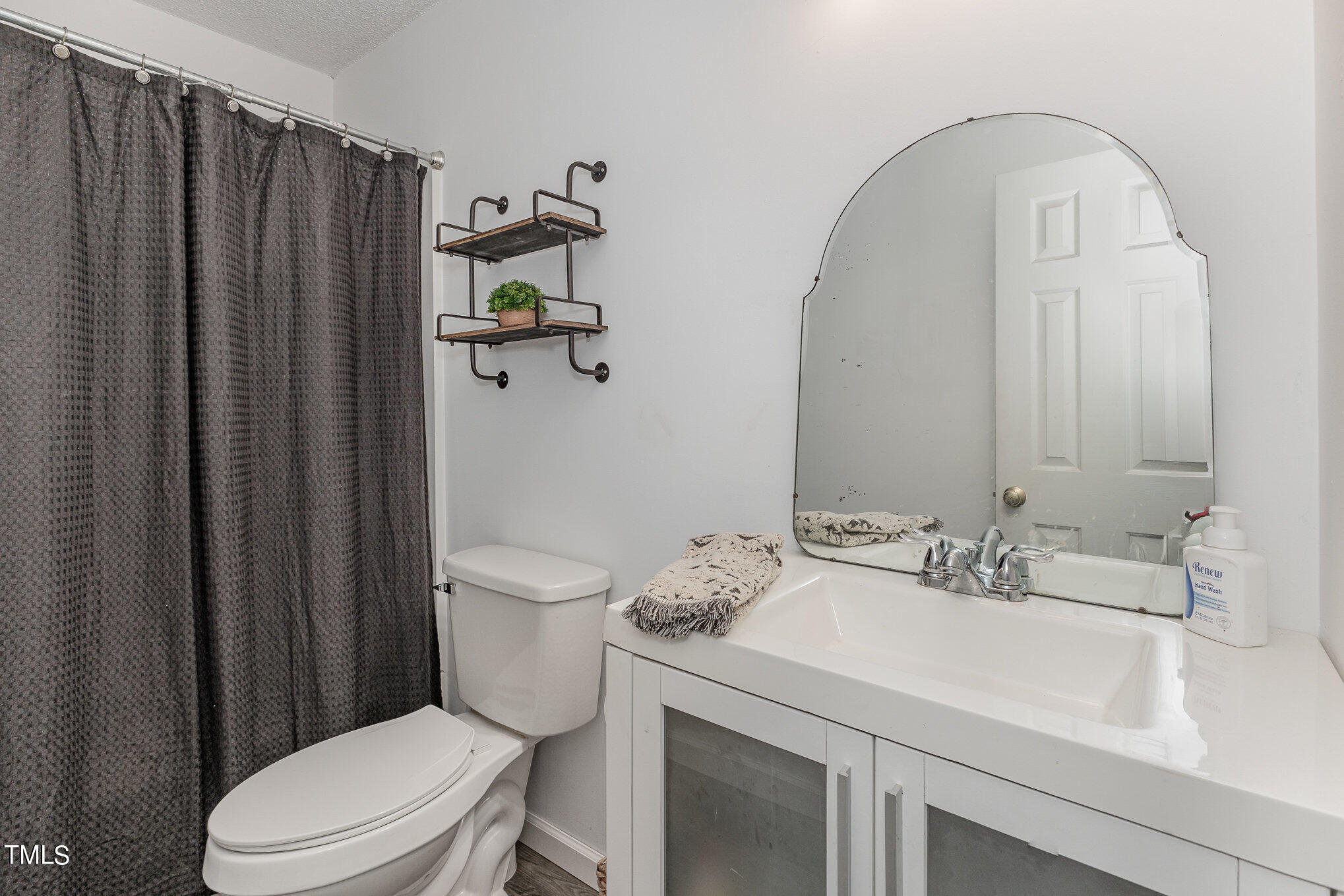 112 Forest Ridge Drive Willow Spring, NC 27592 - Photo 16 of 21 a bathroom with a sink a toilet and shower