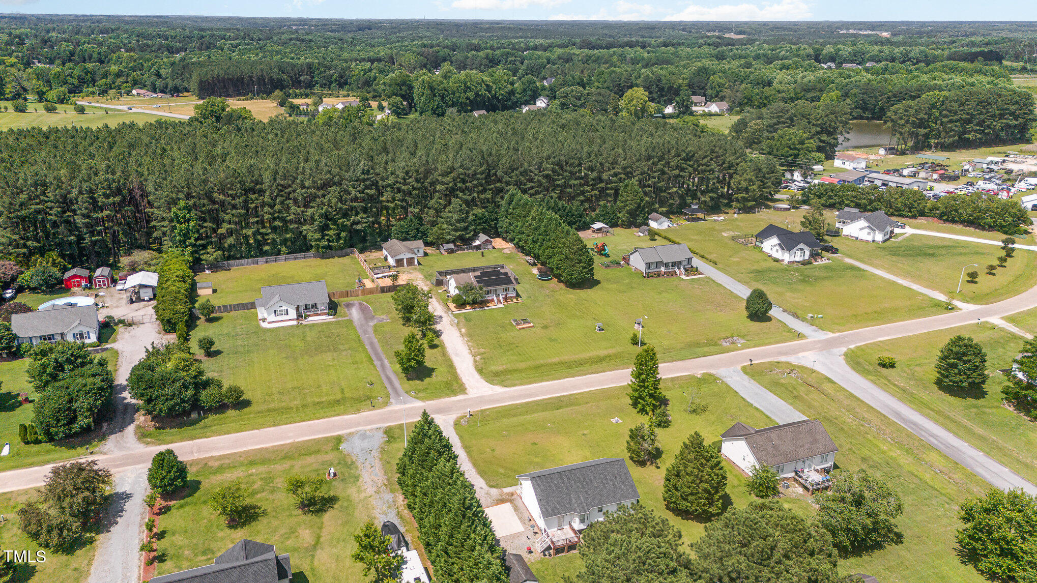 112 Forest Ridge Drive Willow Spring, NC 27592 - Photo 21 of 21 an aerial view of a house with swimming pool and lake view