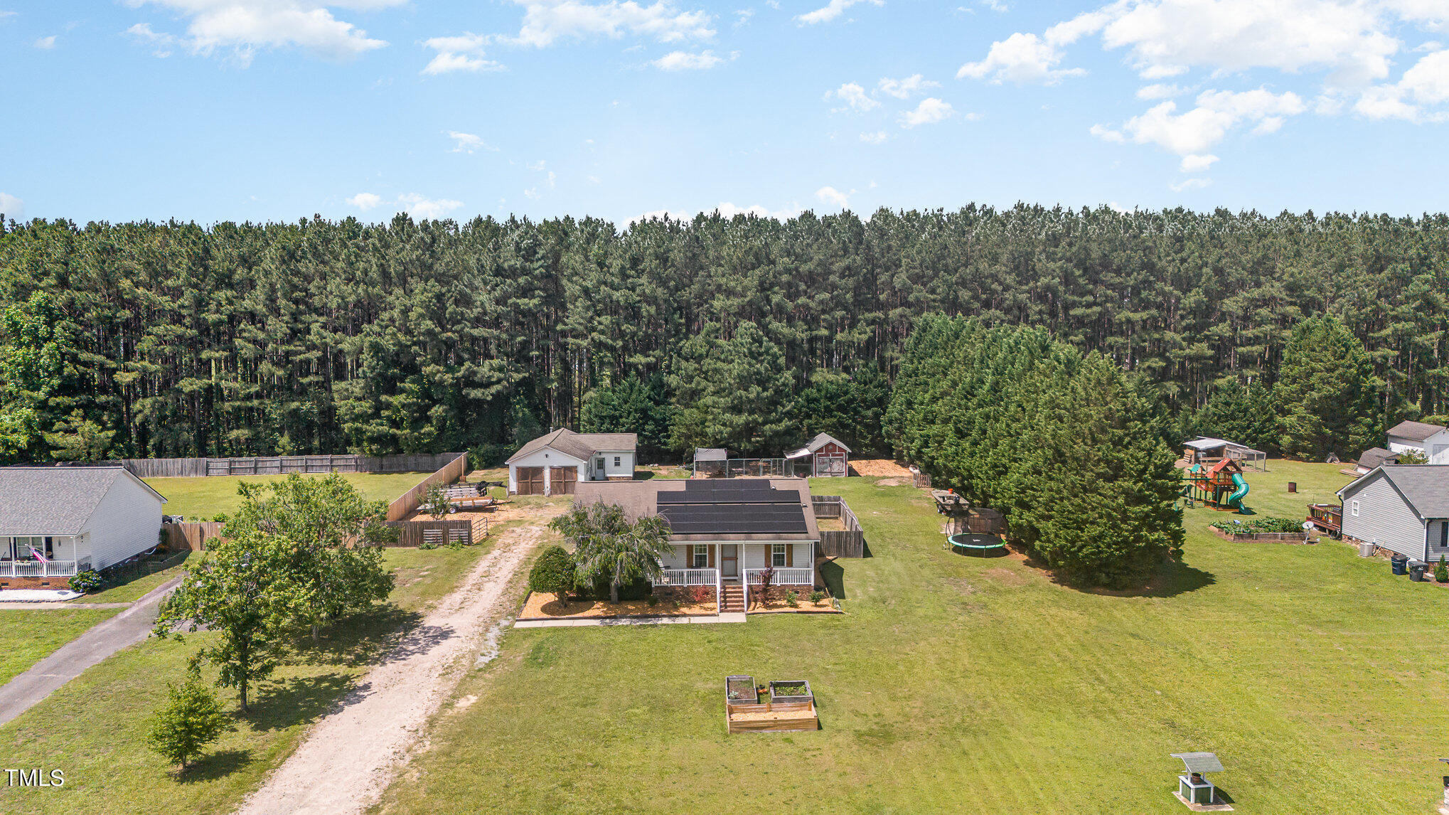 112 Forest Ridge Drive Willow Spring, NC 27592 - Photo 3 of 21 a view of a swimming pool and outdoor space