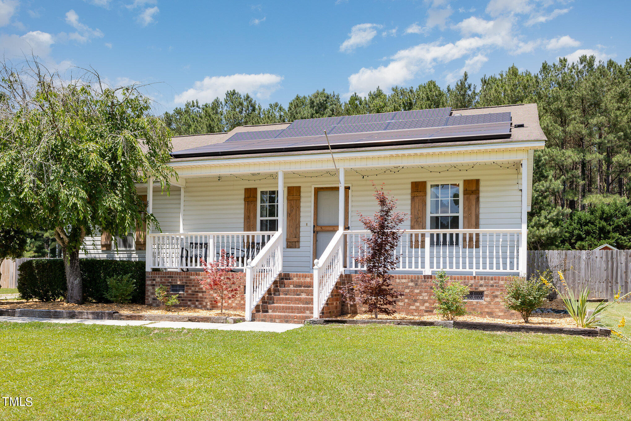 112 Forest Ridge Drive Willow Spring, NC 27592 - Photo 4 of 21 front view of a house with a yard