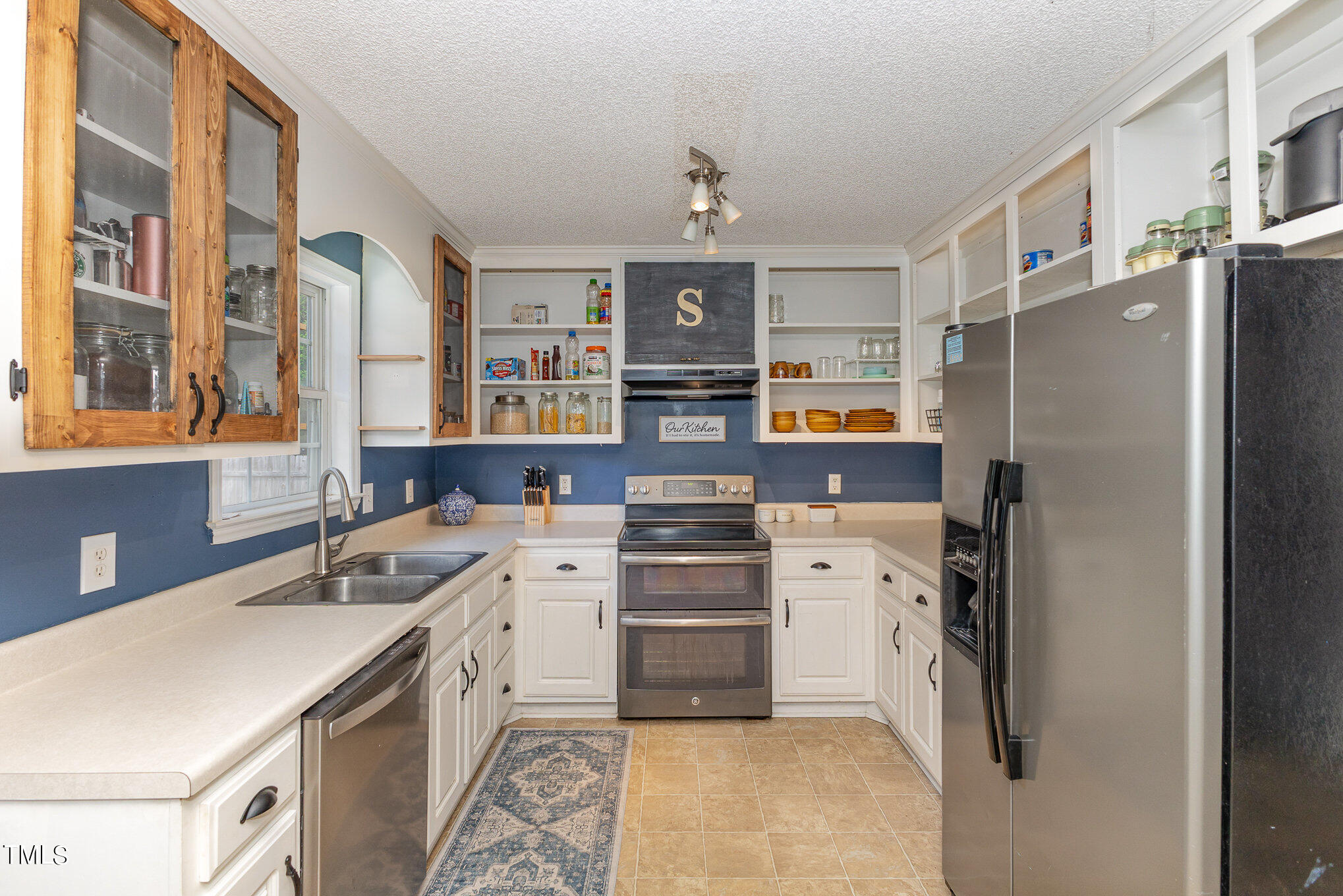 112 Forest Ridge Drive Willow Spring, NC 27592 - Photo 9 of 21 a kitchen that has a refrigerator and a sink