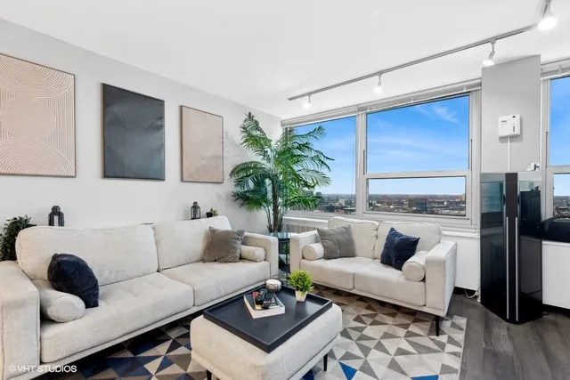 a living room with furniture and a rug
