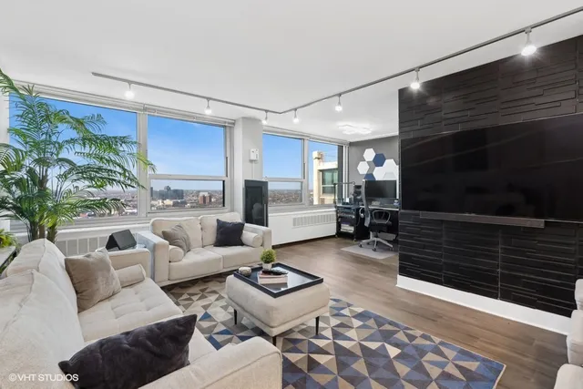 a living room with furniture and a rug