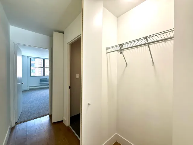 a view of an entryway with wooden floor