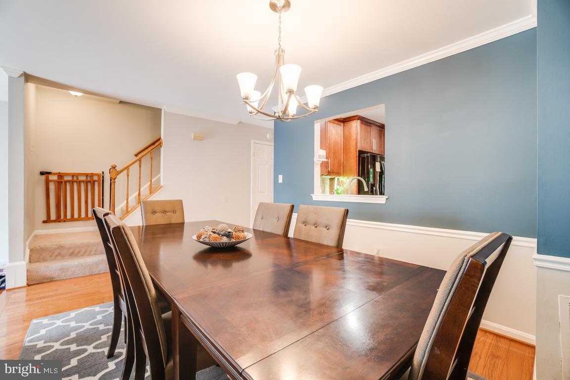6067 Knights Ridge Way Alexandria, VA 22310 - Photo 13 of 39 a view of a dining room with furniture window and wooden floor