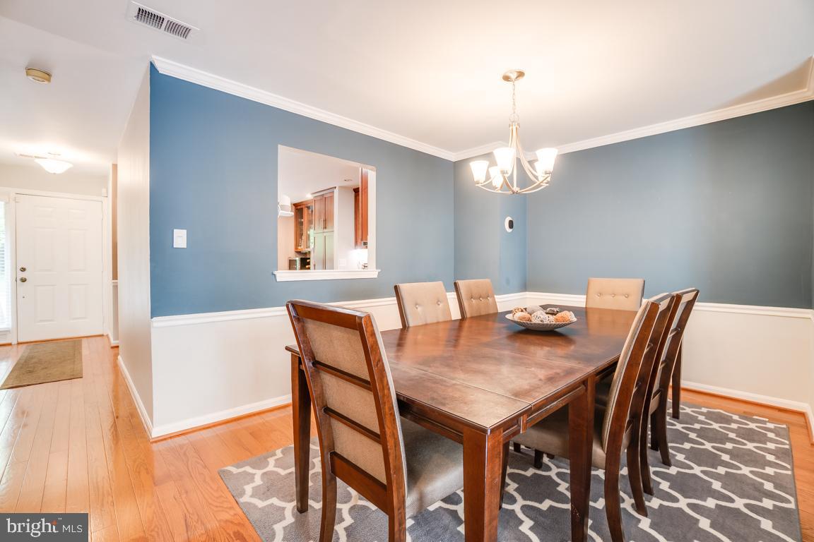 6067 Knights Ridge Way Alexandria, VA 22310 - Photo 14 of 39 a view of a dining room with furniture and wooden floor