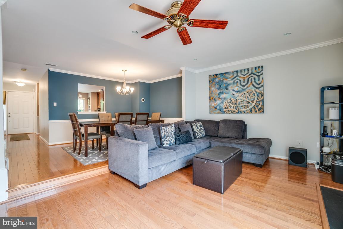 6067 Knights Ridge Way Alexandria, VA 22310 - Photo 16 of 39 a living room with furniture and a flat screen tv