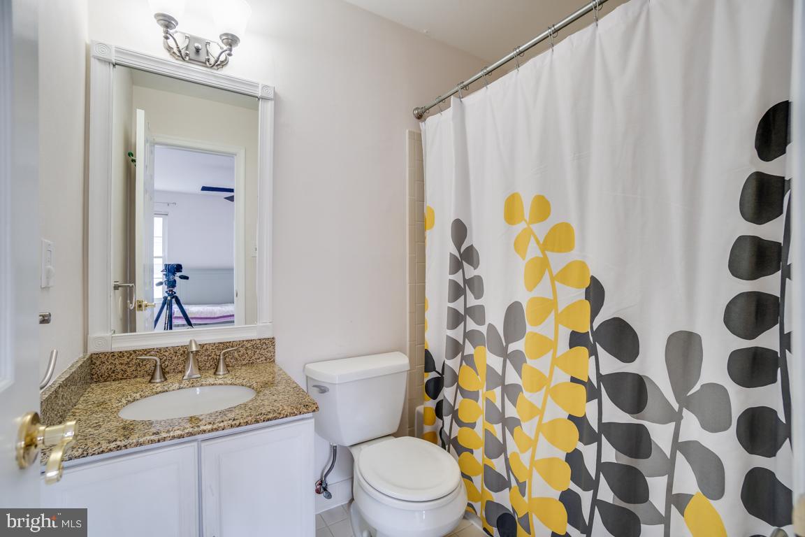 6067 Knights Ridge Way Alexandria, VA 22310 - Photo 22 of 39 a bathroom with a sink and a mirror