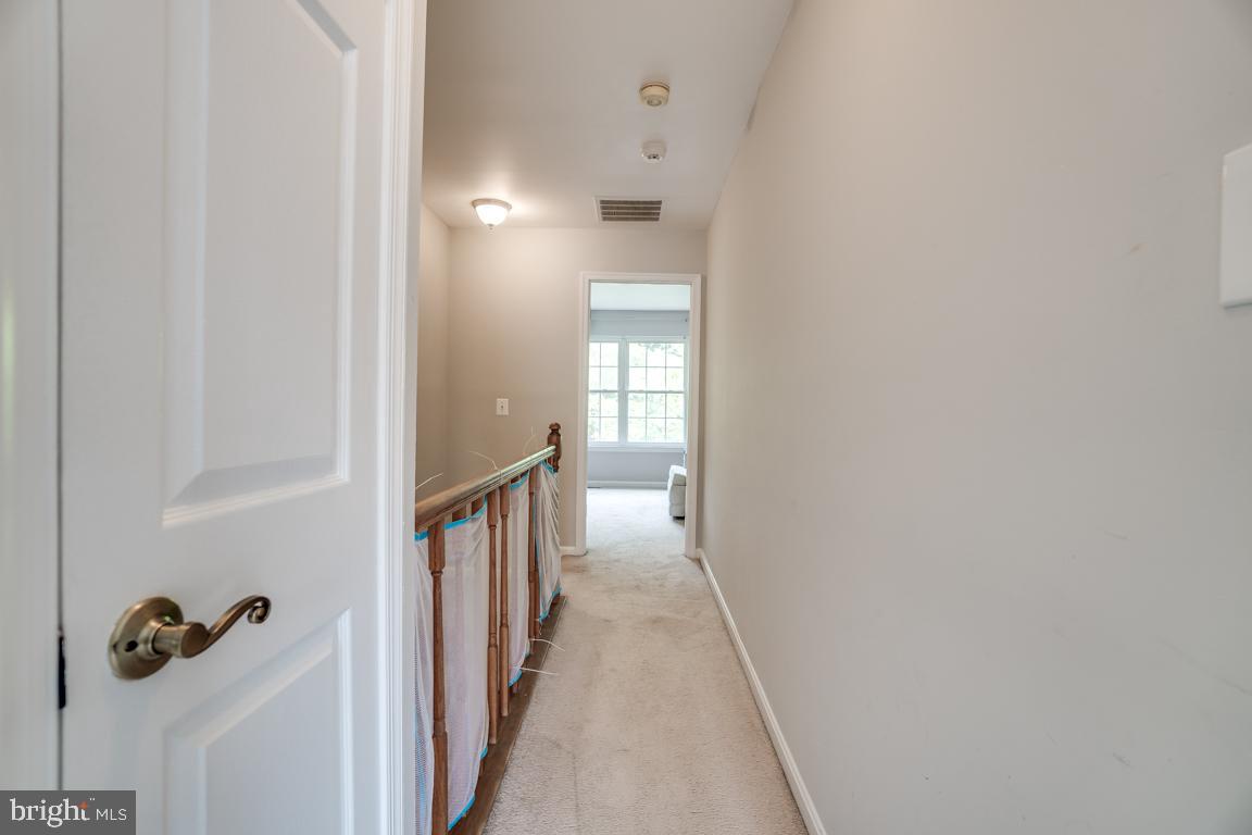 6067 Knights Ridge Way Alexandria, VA 22310 - Photo 23 of 39 a view of a hallway