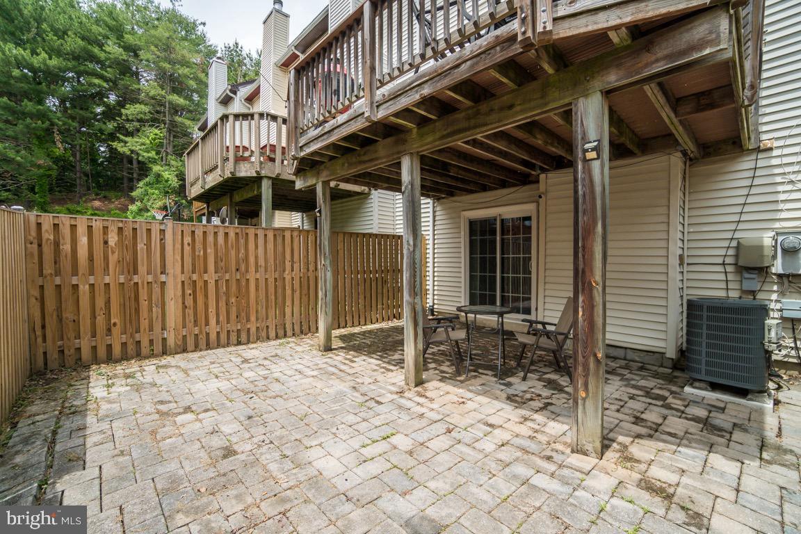 6067 Knights Ridge Way Alexandria, VA 22310 - Photo 38 of 39 a backyard of a house with table and chairs