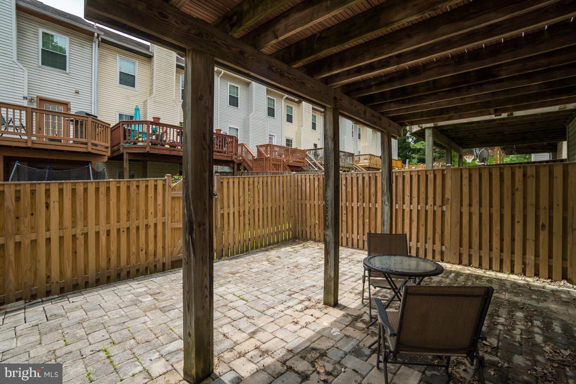 6067 Knights Ridge Way Alexandria, VA 22310 - Photo 39 of 39 a patio with table and chairs