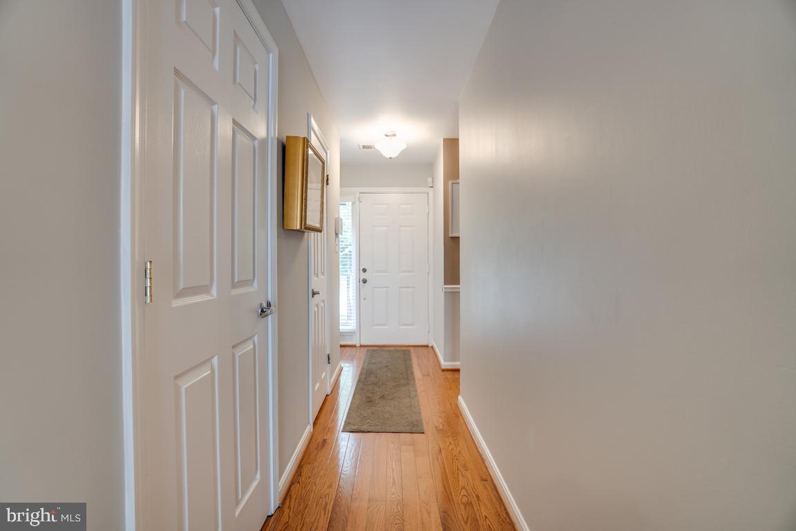 6067 Knights Ridge Way Alexandria, VA 22310 - Photo 6 of 39 a view of a hallway with wooden floor
