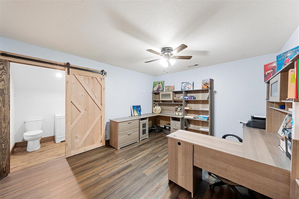 399 Satin Road Chilton, TX 76632 - Photo 16 of 34 a view of a workspace with furniture and wooden floor
