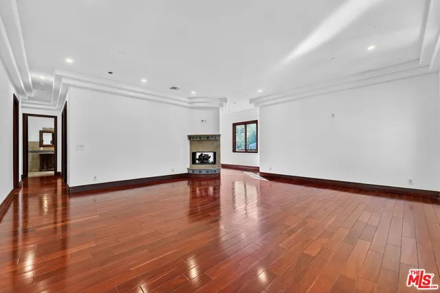 a kitchen with stainless steel appliances granite countertop a stove a sink a refrigerator and a refrigerator