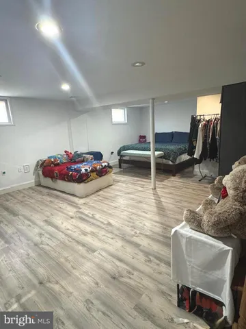 a bedroom with a bed and a chair