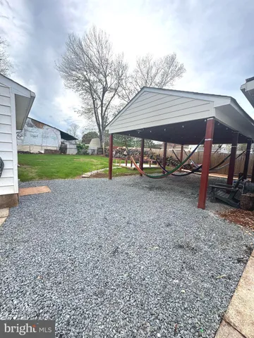 a view of a park with large trees