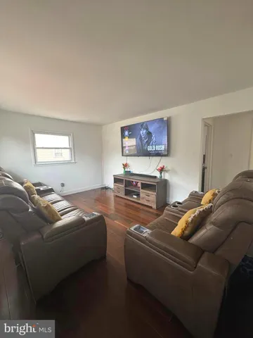 a living room with furniture window and a lamp