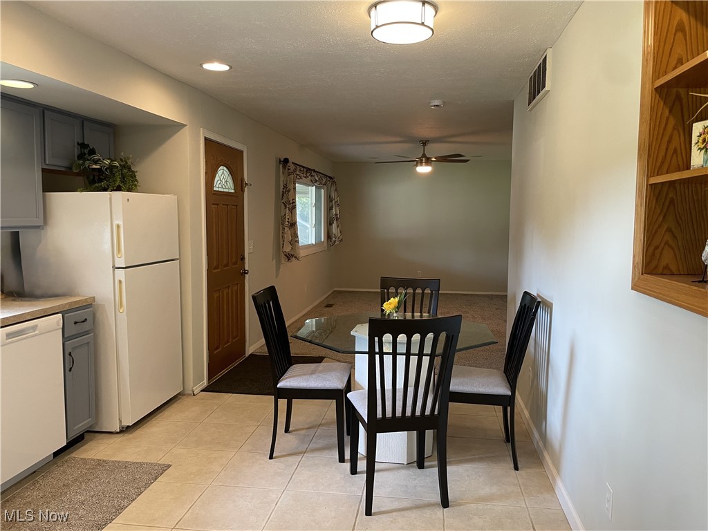 5741 Jaycox Road North Ridgeville, OH 44039 - Photo 7 of 23 Dining space featuring a ceiling fan, recessed lighting, and light tile patterned flooring