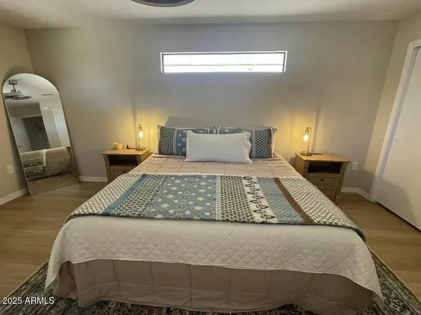 a bedroom with a large bed and a table