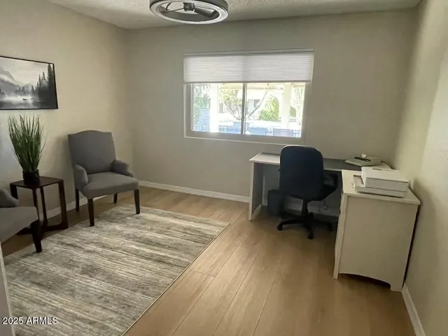 a living room with furniture and a window