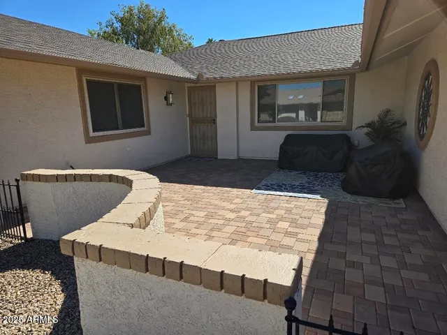 a living room with a couch and a dresser