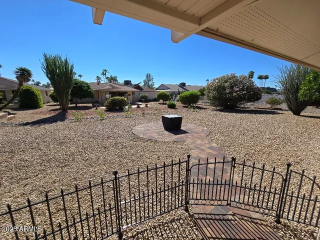 a view of a roof deck with potted plants