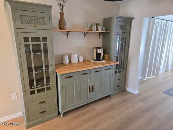 a kitchen with stainless steel appliances a refrigerator and cabinets