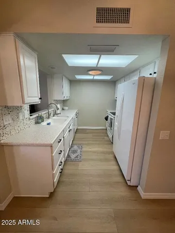 a bathroom with a sink a mirror and a shower