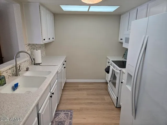 a bathroom with a sink and a large mirror