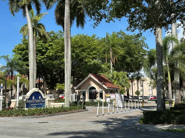 a view of multiple houses with a street
