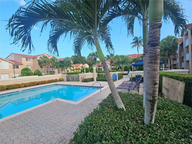a view of a park with large trees