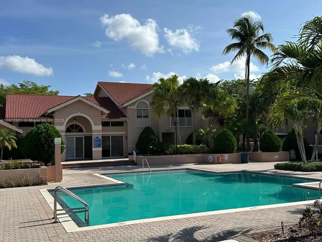 a view of a park with slide and swing