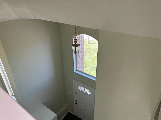 a bathroom with a mirror and a shower