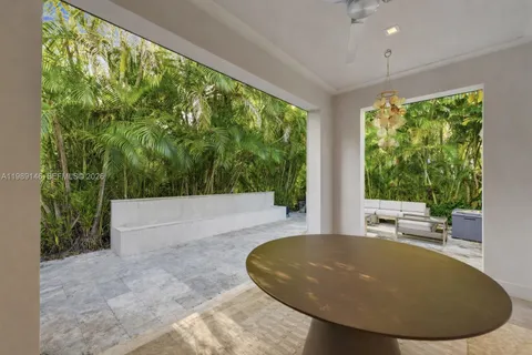 a view of a swimming pool and trees in the background