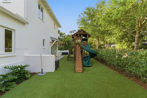 a view of a backyard with couches
