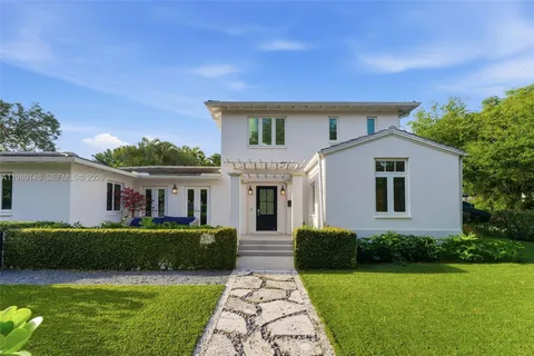 a front view of a house with garden