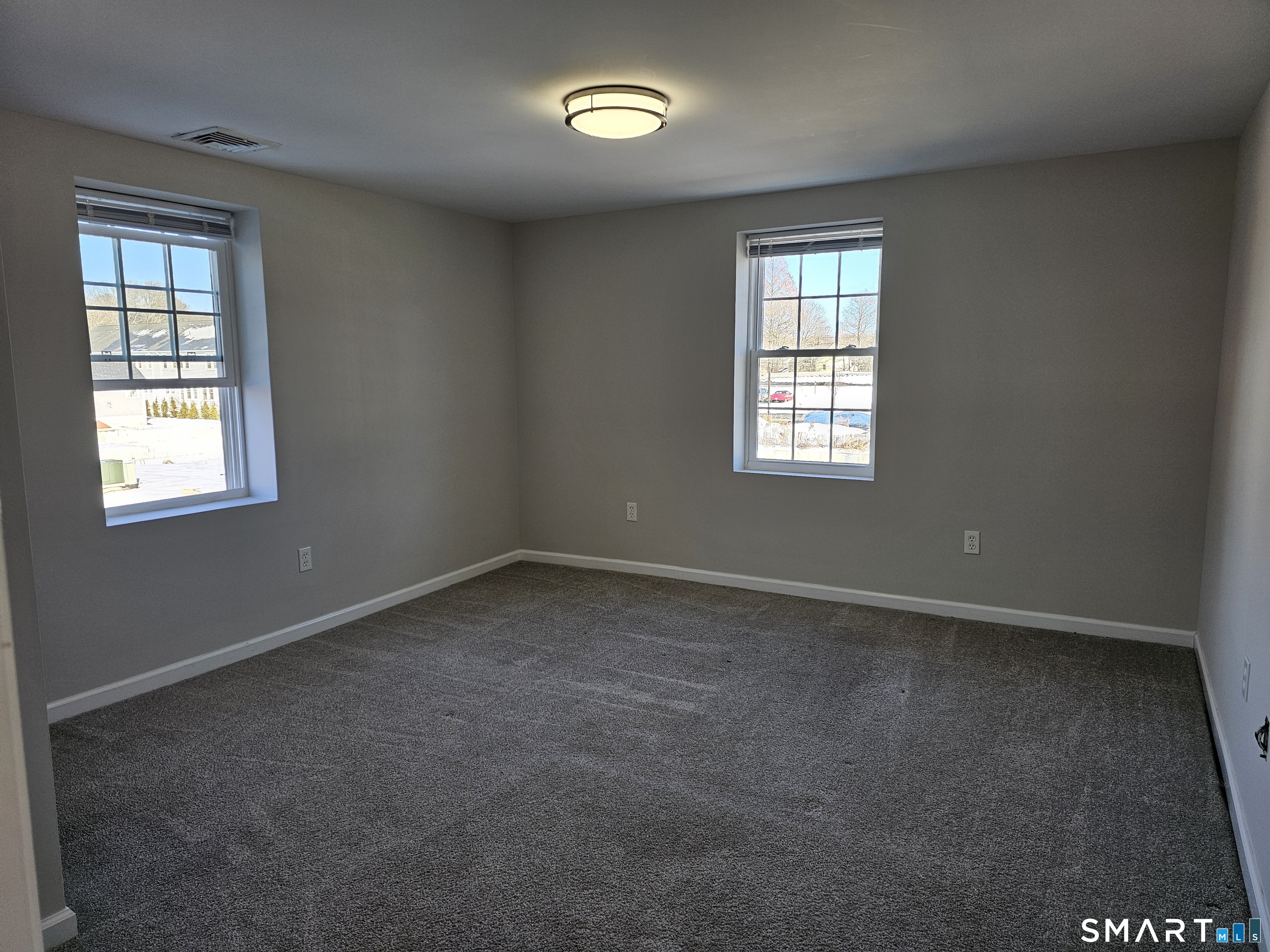 151 East Main Street, Unit 2B Clinton, CT 06413 - Photo 7 of 10 an empty room with a window