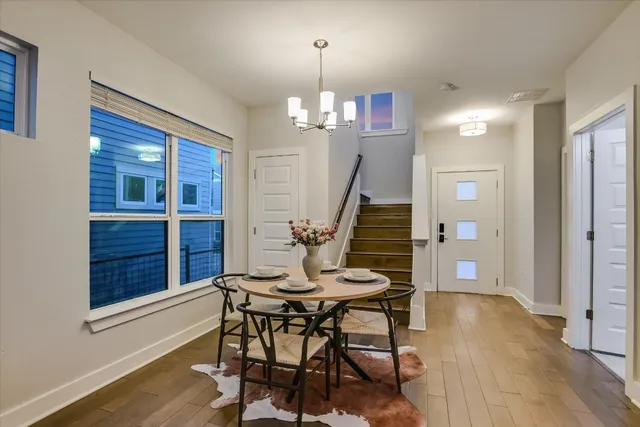 a view of a dining room with furniture window and wooden floor