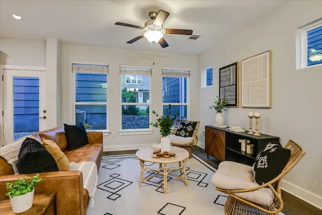 a living room with furniture chandelier and a chandelier