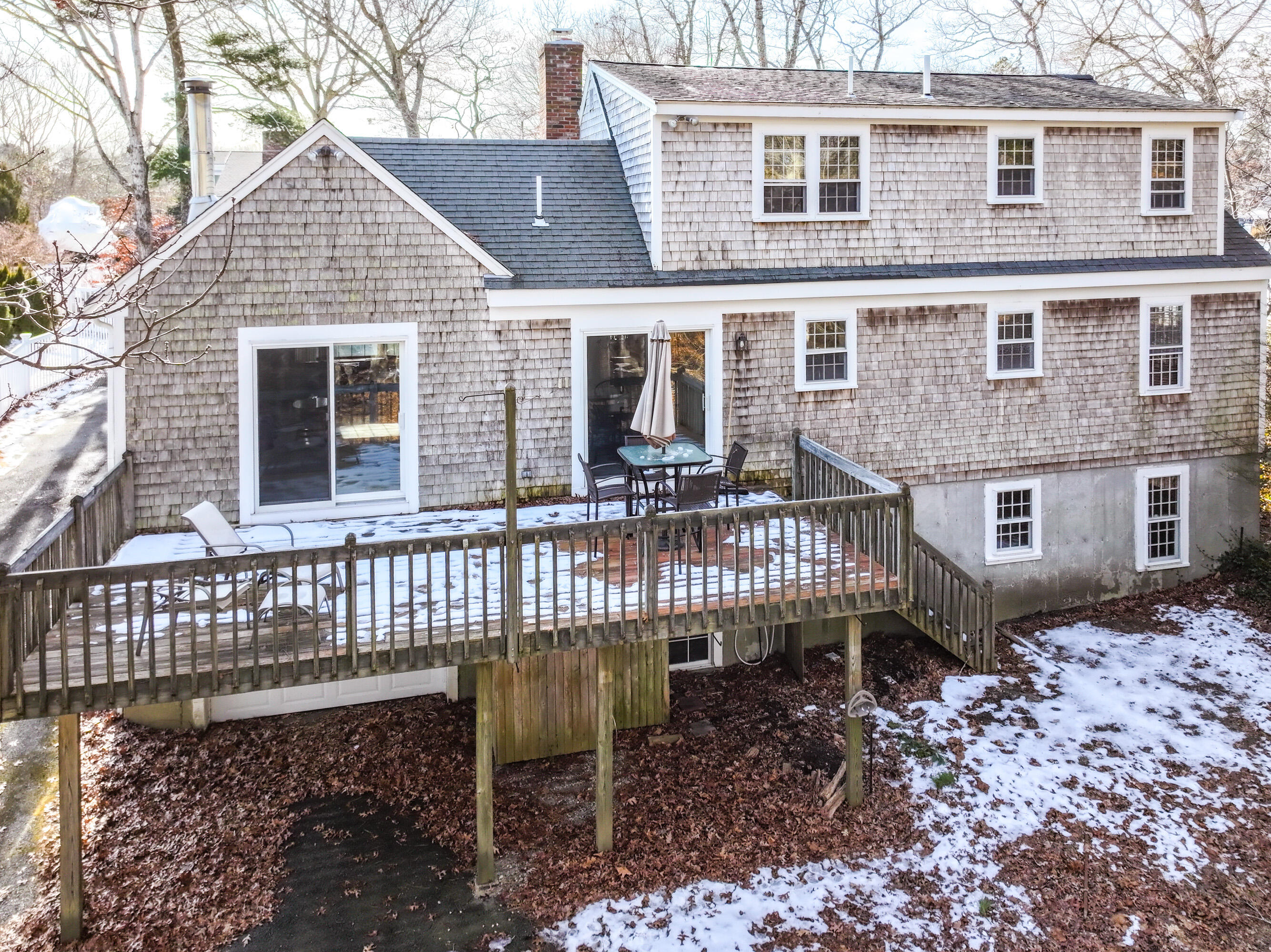 12 Canapitsit Drive East Falmouth, MA 02536 - Photo 32 of 34 a front view of a house with a patio