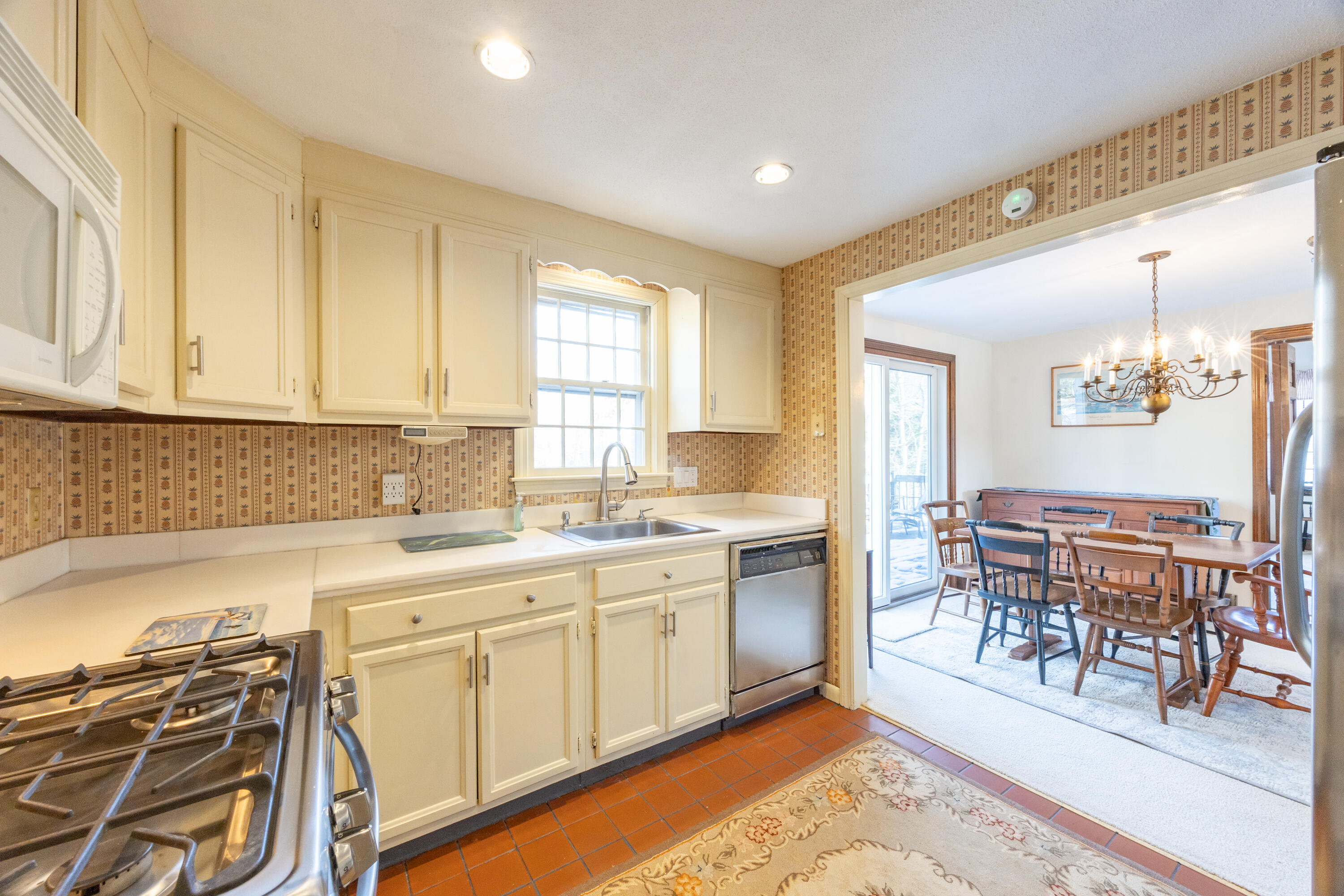 12 Canapitsit Drive East Falmouth, MA 02536 - Photo 8 of 34 a kitchen with a sink stove and cabinets
