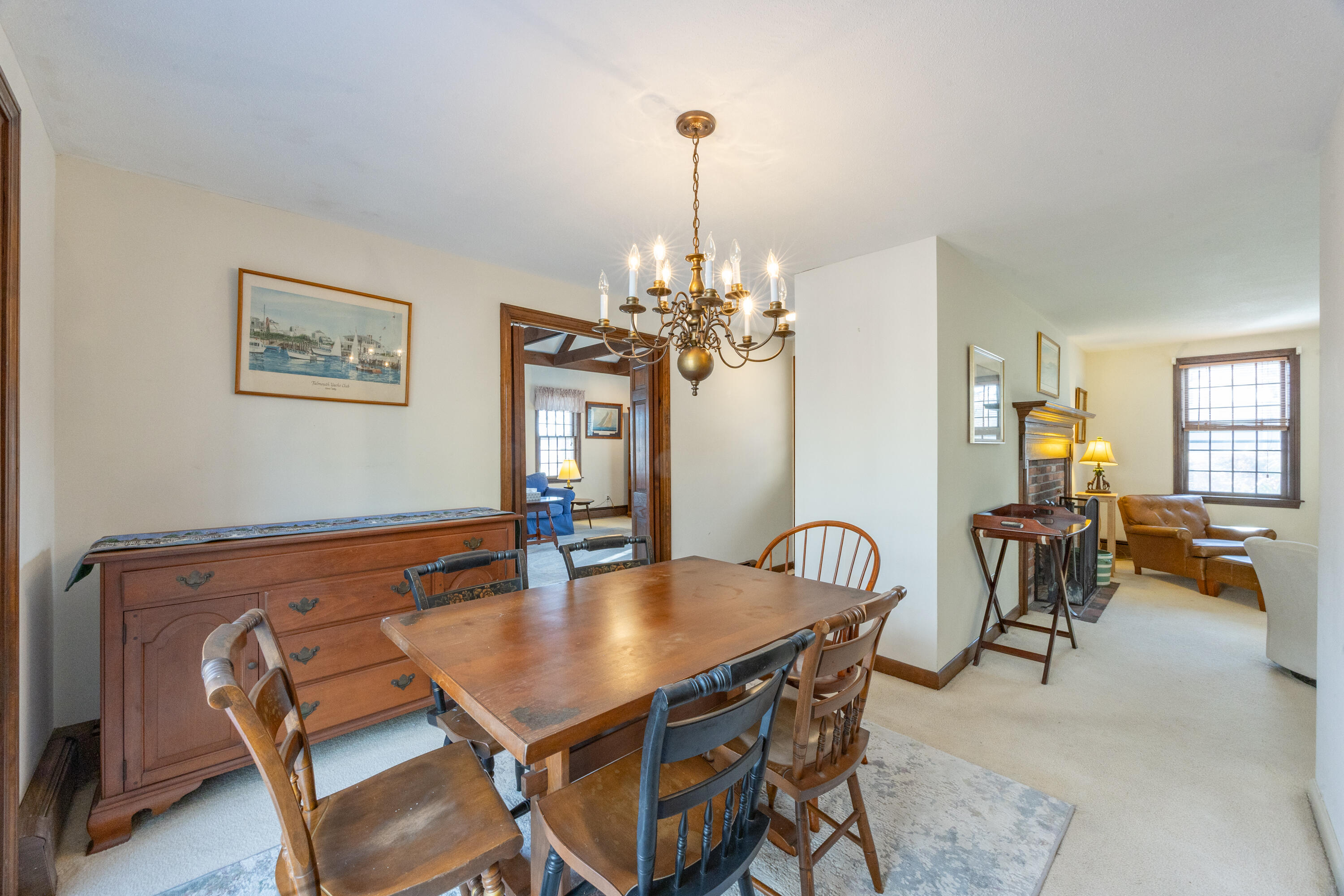 12 Canapitsit Drive East Falmouth, MA 02536 - Photo 9 of 34 a view of a dining room with furniture and chandelier
