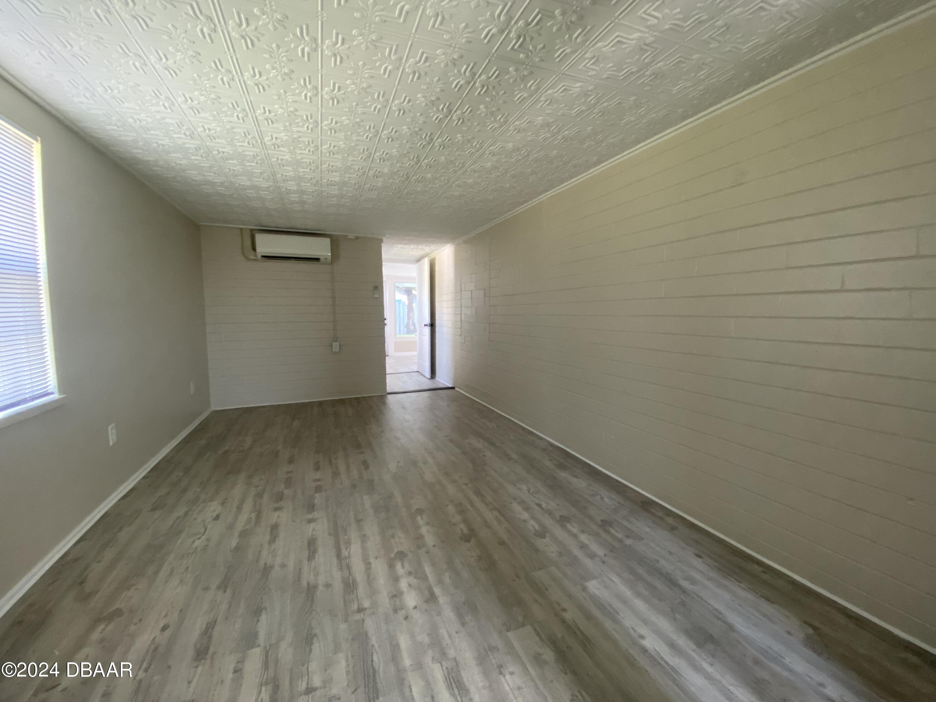 28 Rivershore Drive Ormond Beach, FL 32176 - Photo 12 of 16 a view of room with window and hardwood floor