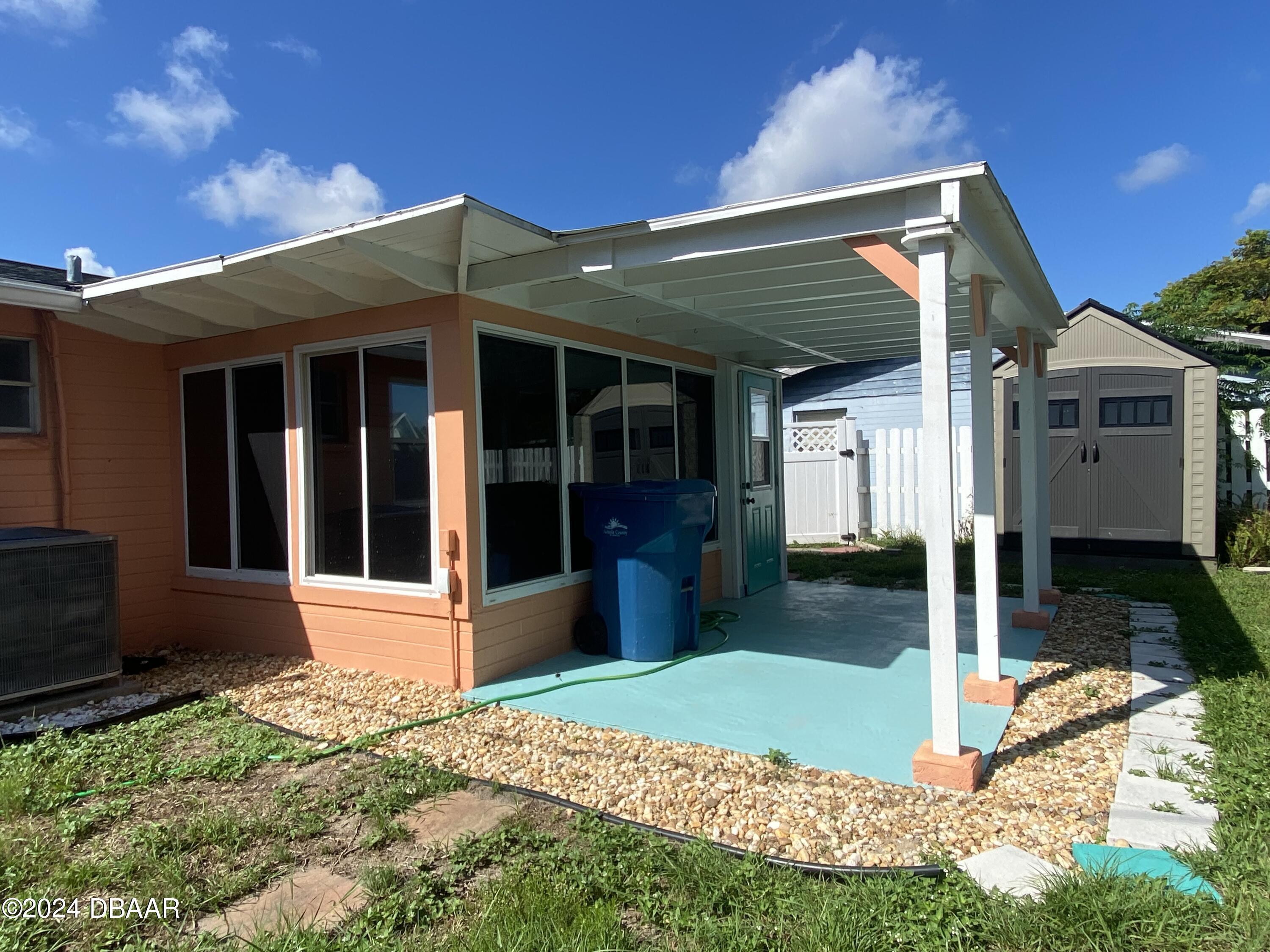 28 Rivershore Drive Ormond Beach, FL 32176 - Photo 16 of 16 a front view of a house with garden