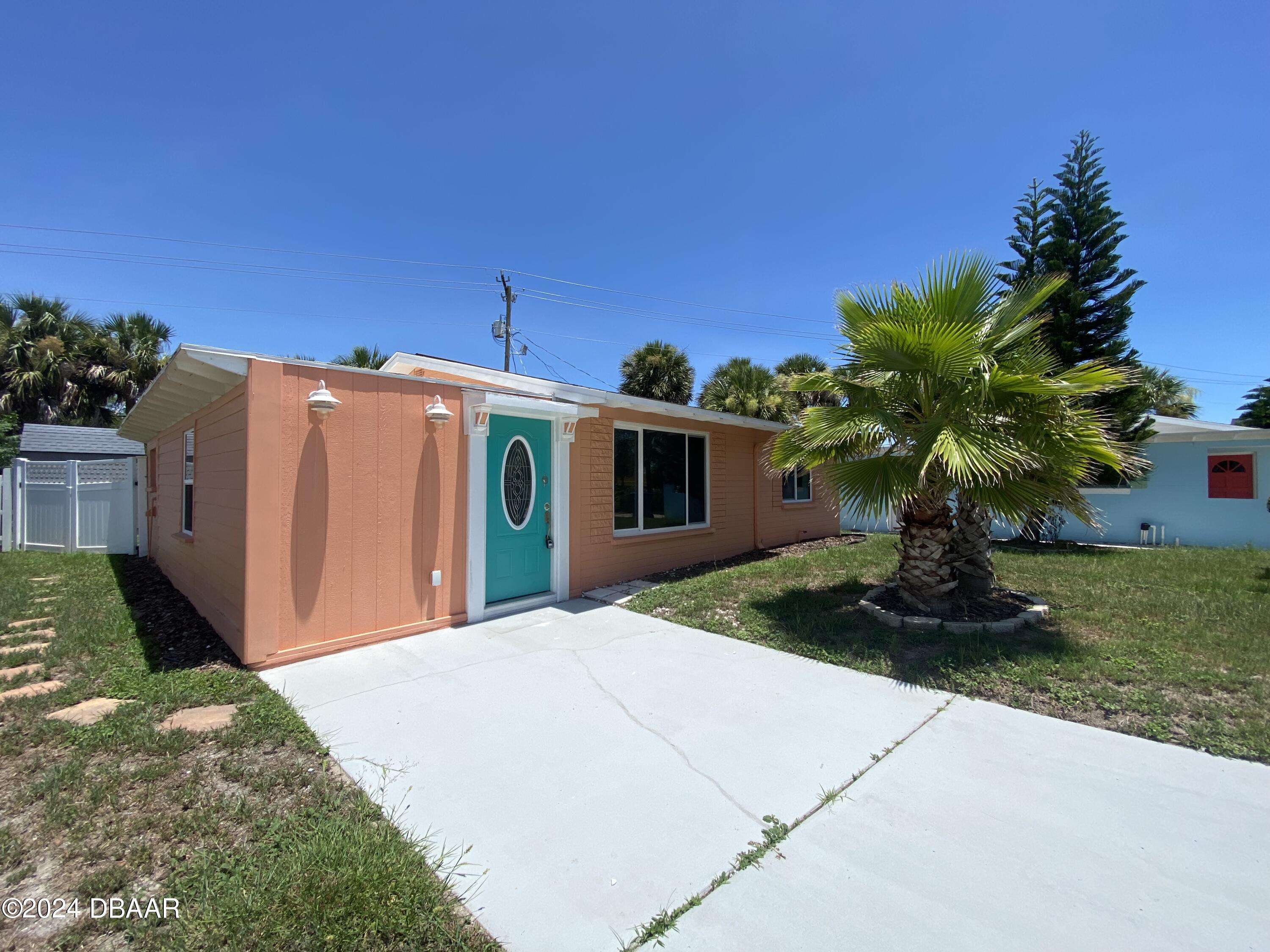 28 Rivershore Drive Ormond Beach, FL 32176 - Photo 2 of 16 a front view of a house with garden