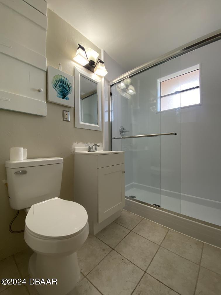 28 Rivershore Drive Ormond Beach, FL 32176 - Photo 9 of 16 a white toilet sitting next to a bathroom sink